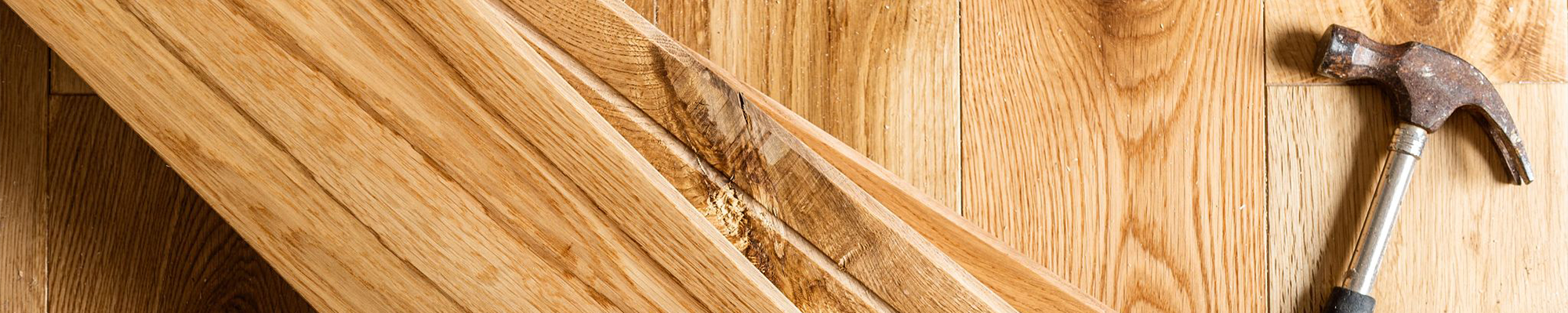 Planks and hammer from Cornerstone Flooring Brokers Sun City in Sun City, AZ