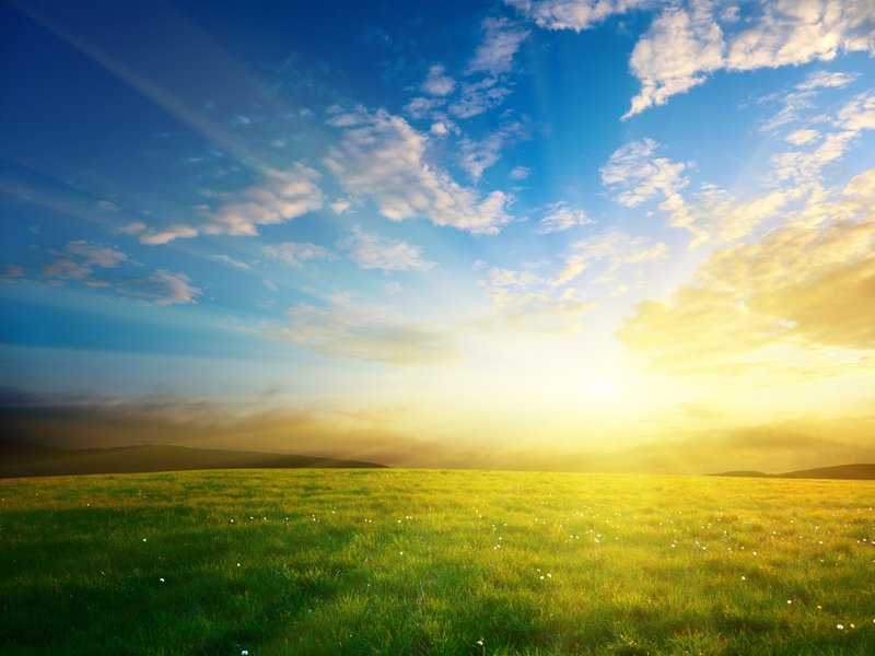 sunrise over green grass from Cornerstone Flooring Brokers Sun City in Sun City, AZ