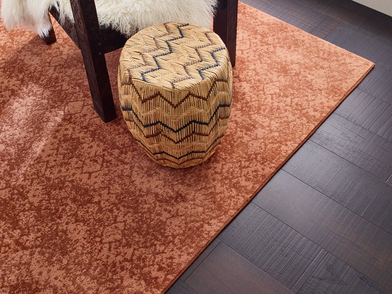 Chair on rug from Cornerstone Flooring Brokers Sun City in Sun City, AZ